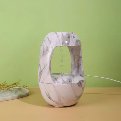 Humidificateur décoratif HUMEA avec brume anti-gravité et design en marbre